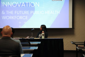 Panelist listens during breakout session.