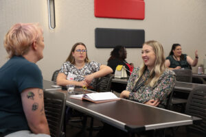Audience members discuss topics during a breakout session.